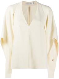 draped-sleeve deep-V blouse