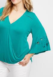 plus size wrap front blouse with detailed bell sleeves 